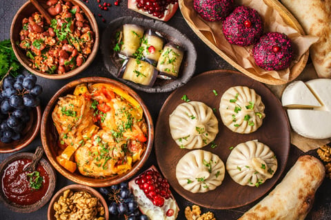 Traditional Georgian cuisine with khinkali, phali, chahokhbili, lobio, cheese and eggplant rolls